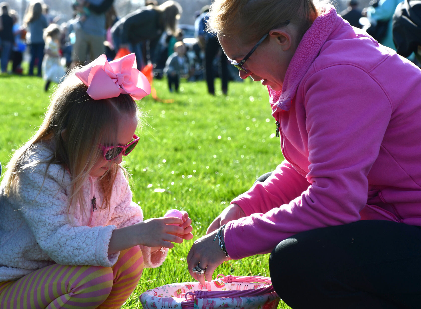 Massey Gilley sorts eggs with her mom